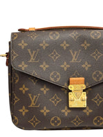 Load image into Gallery viewer, Designer handbag with monogram pattern and gold lock on a white background
