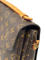 Load image into Gallery viewer, Close-up of a brown handbag with gold monogram pattern

