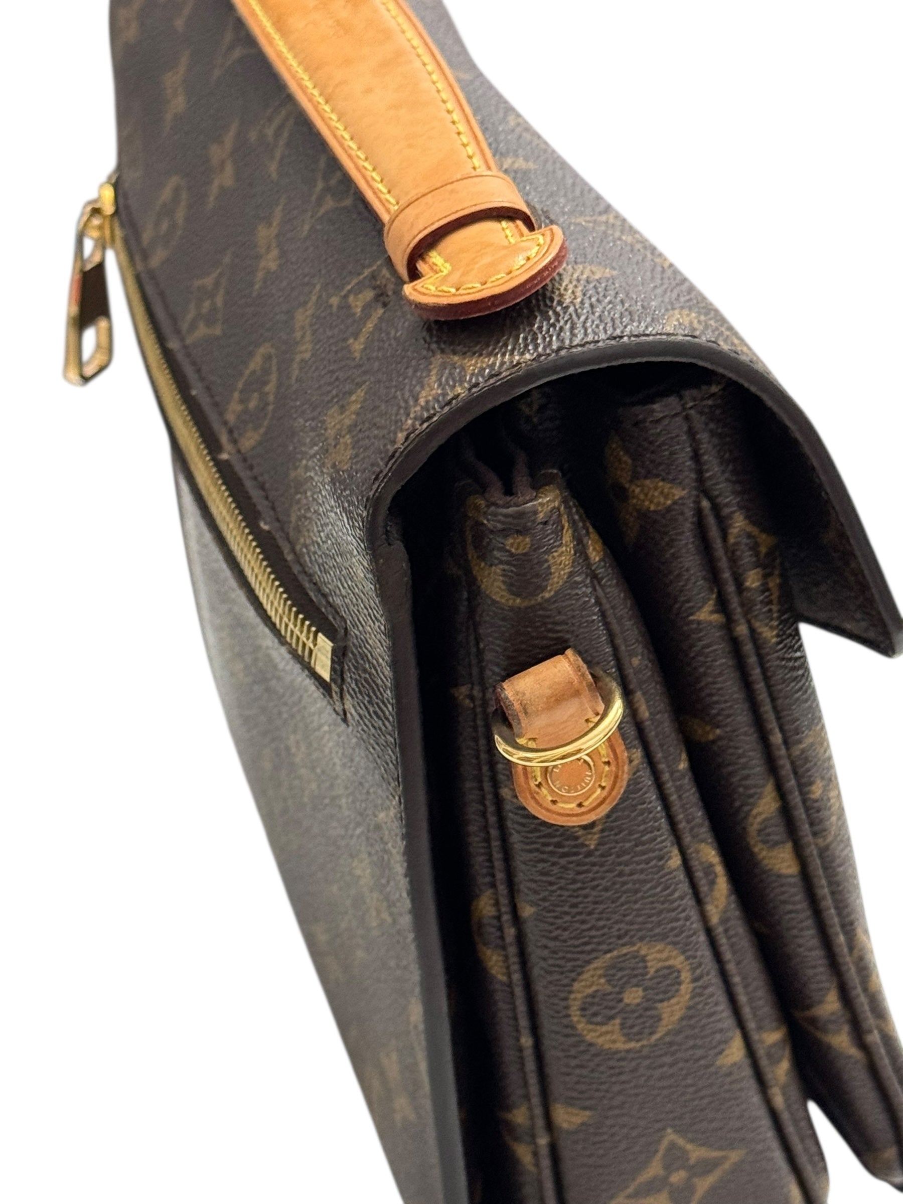 Louis Vuitton monogram handbag with gold hardware on a white background