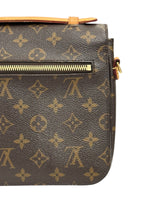 Load image into Gallery viewer, Brown handbag with gold monogram pattern on a white background
