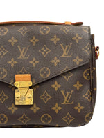 Load image into Gallery viewer, Brown handbag with gold lock and monogram pattern on a white background
