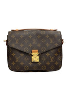 Load image into Gallery viewer, Designer handbag with monogram pattern on a white background
