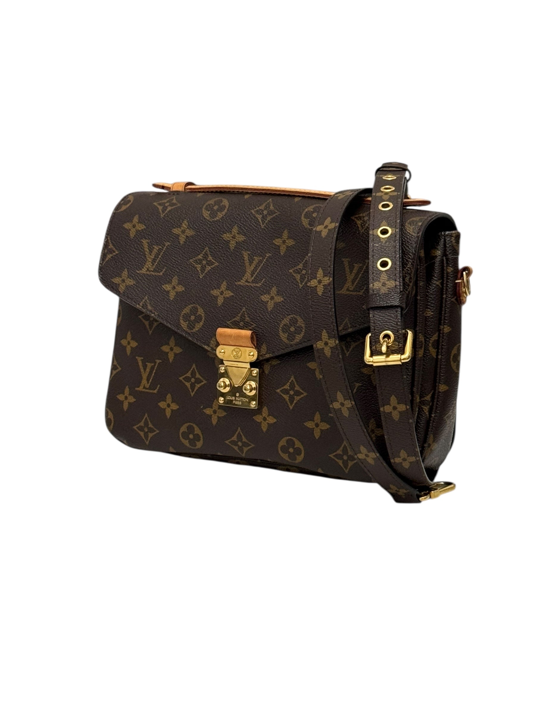 Designer handbag with monogram pattern on a white background