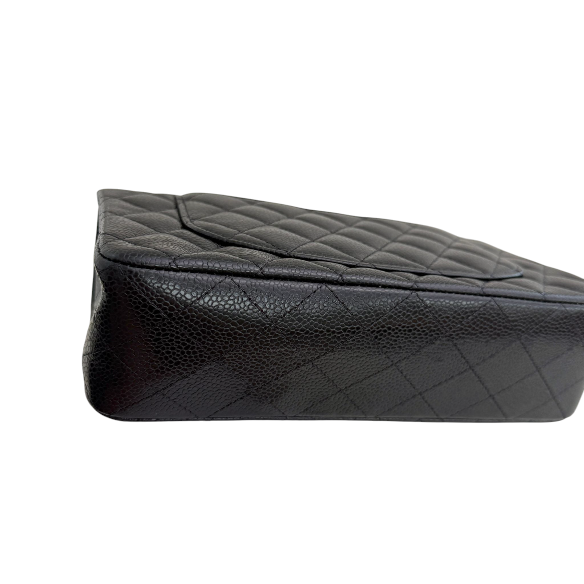 Black quilted leather seat cover on a white background