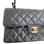 Charger l&#39;image dans la galerie, Quilted gray handbag with gold Chanel logo on a white background
