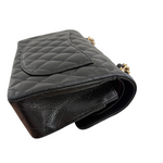 Charger l&#39;image dans la galerie, Black quilted handbag with gold hardware on a white background
