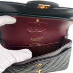 Charger l&#39;image dans la galerie, Chanel handbag with open interior showing quilted design and brand logo.
