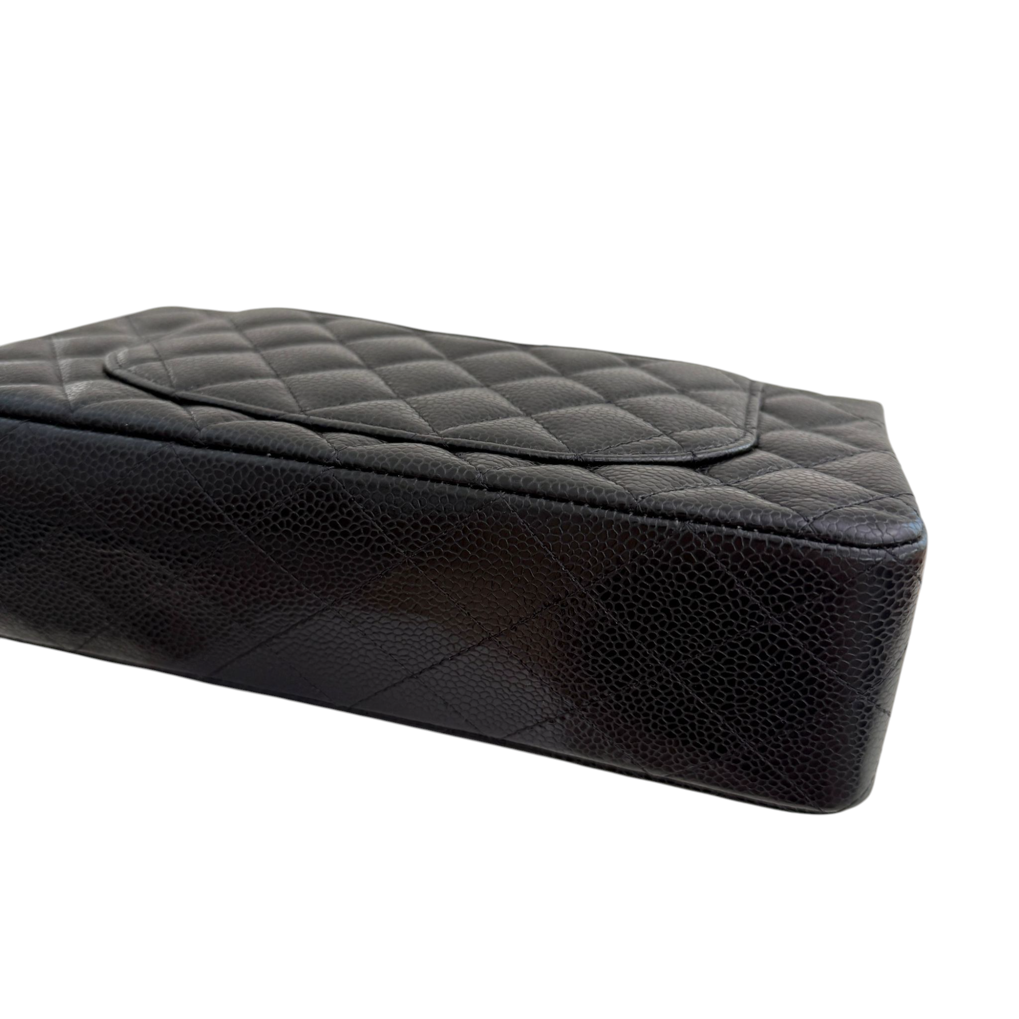 Black quilted leather car seat cover on a white background
