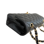 Charger l&#39;image dans la galerie, Black quilted handbag with gold chain strap on a white background
