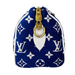 将图片加载到图库查看器，Blue pouch with white monogram pattern and gold zipper on a white background
