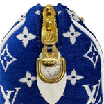 将图片加载到图库查看器，Blue pouch with white monogram pattern and gold zipper, featuring a prominent brand logo.
