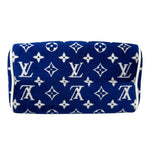 将图片加载到图库查看器，Blue pouch with white monogram pattern on a white background
