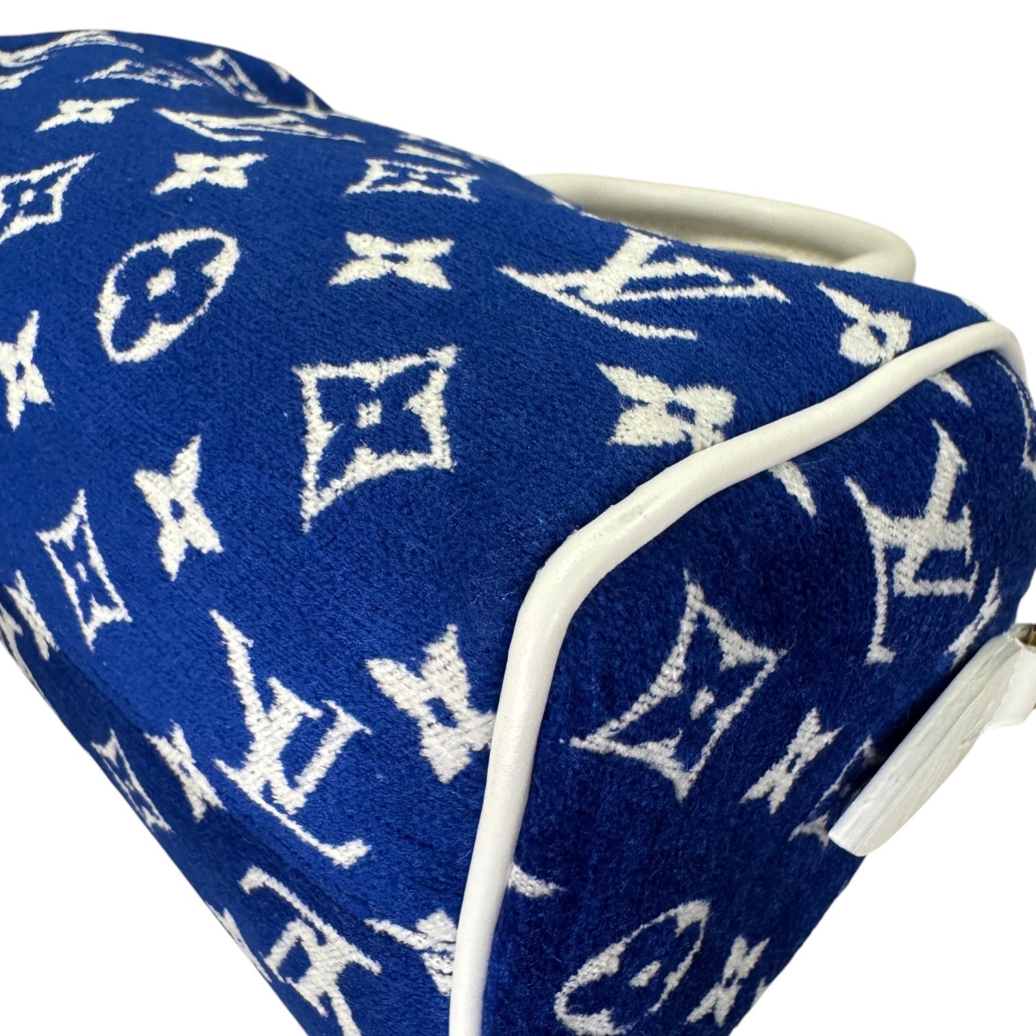 Blue fabric with white logo pattern on a white background