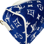 将图片加载到图库查看器，Blue pouch with white monogram pattern on a white background
