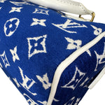 将图片加载到图库查看器，Blue handbag with white monogram pattern on a white background

