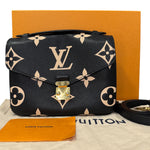 Charger l&#39;image dans la galerie, Louis Vuitton handbag with monogram pattern on a branded surface
