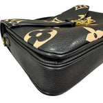 Charger l&#39;image dans la galerie, Black leather handbag with gold floral patterns on a white background
