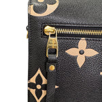 Charger l&#39;image dans la galerie, Black leather bag with gold monogram pattern and Louis Vuitton logo on zipper pull.
