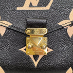 Charger l&#39;image dans la galerie, Close-up of a Louis Vuitton handbag with gold hardware and monogram pattern.
