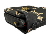 Charger l&#39;image dans la galerie, Black leather handbag with gold accents on a white background

