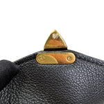Charger l&#39;image dans la galerie, Close-up of a black leather bag with gold hardware on a white background
