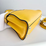 将图片加载到图库查看器，Yellow leather handbag with a strap on a light gray background
