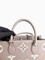 Load image into Gallery viewer, Louis Vuitton LV OnTheGo MM Tote Empreinte Leather Beige/Cream
