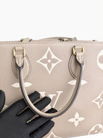 Load image into Gallery viewer, Louis Vuitton LV OnTheGo MM Tote Empreinte Leather Beige/Cream
