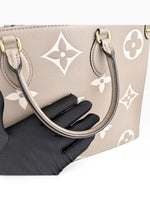 Load image into Gallery viewer, Louis Vuitton LV OnTheGo MM Tote Empreinte Leather Beige/Cream

