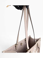 Load image into Gallery viewer, Louis Vuitton LV OnTheGo MM Tote Empreinte Leather Beige/Cream
