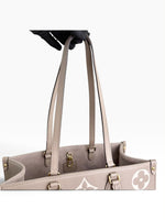 Load image into Gallery viewer, Louis Vuitton LV OnTheGo MM Tote Empreinte Leather Beige/Cream
