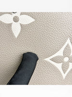 Load image into Gallery viewer, Louis Vuitton LV OnTheGo MM Tote Empreinte Leather Beige/Cream
