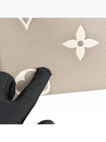 Load image into Gallery viewer, Louis Vuitton LV OnTheGo MM Tote Empreinte Leather Beige/Cream
