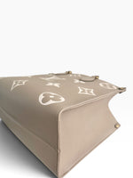 Load image into Gallery viewer, Louis Vuitton LV OnTheGo MM Tote Empreinte Leather Beige/Cream
