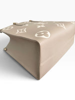 Load image into Gallery viewer, Louis Vuitton LV OnTheGo MM Tote Empreinte Leather Beige/Cream
