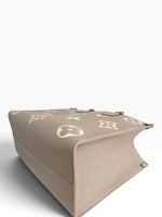 Load image into Gallery viewer, Louis Vuitton LV OnTheGo MM Tote Empreinte Leather Beige/Cream
