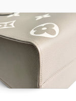 Load image into Gallery viewer, Louis Vuitton LV OnTheGo MM Tote Empreinte Leather Beige/Cream
