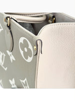 Load image into Gallery viewer, Louis Vuitton LV OnTheGo MM Tote Empreinte Leather Beige/Cream
