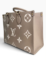 Load image into Gallery viewer, Louis Vuitton LV OnTheGo MM Tote Empreinte Leather Beige/Cream
