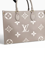 Load image into Gallery viewer, Louis Vuitton LV OnTheGo MM Tote Empreinte Leather Beige/Cream
