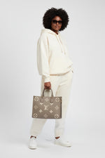Load image into Gallery viewer, Louis Vuitton LV OnTheGo MM Tote Empreinte Leather Beige/Cream
