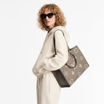 Load image into Gallery viewer, Louis Vuitton LV OnTheGo MM Tote Empreinte Leather Beige/Cream
