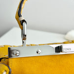 将图片加载到图库查看器，Close-up of a yellow Fendi handbag with a silver clasp on a light gray background
