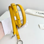 将图片加载到图库查看器，Yellow leather strap on a white surface with a visible brand name.
