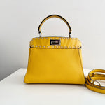 将图片加载到图库查看器，Yellow handbag with studded detail on a white surface
