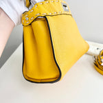 将图片加载到图库查看器，Yellow handbag with studded detail on a white surface

