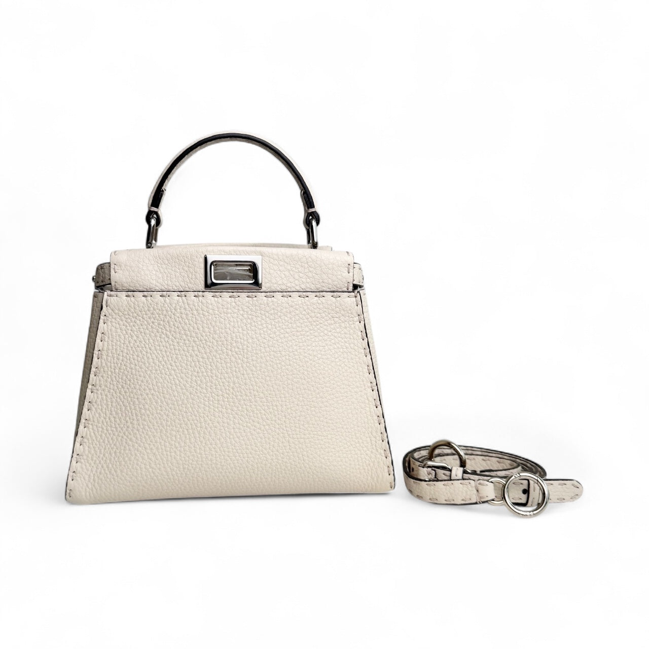 White handbag with a matching belt on a white background