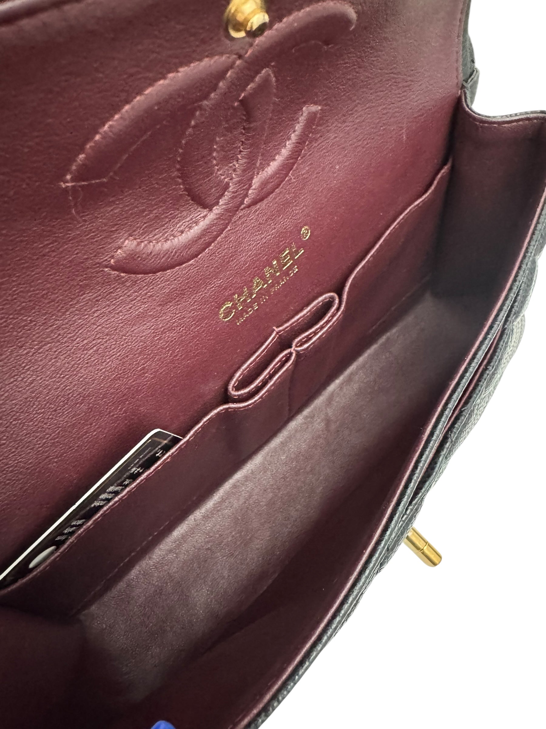 Close-up of a Chanel handbag with visible branding.