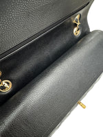 将图片加载到图库查看器，Close-up of a black leather handbag with gold hardware on a white background
