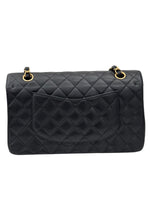 将图片加载到图库查看器，Black quilted handbag with gold hardware on a white background
